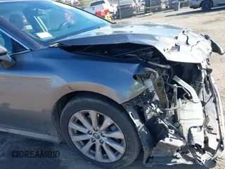 2019 Toyota Camry LE with VIN 4T1B11HK4KU254853, listed as a IAAI auction lot 42013255 with 153,664 mi miles and . Bid and sale history available at DreamBid. Image 17.