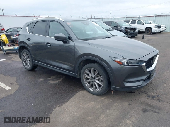 2020 Mazda CX-5 Grand Touring with VIN JM3KFBDM4L0829861, listed as a IAAI auction lot 41826250 with 62,091 mi miles and . Bid and sale history available at carsss.com. Image 1.