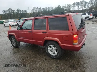 1999 Jeep Cherokee Sport with VIN 1J4FT68S1XL601799, listed as a Copart auction lot 83881844 with 203,572 mi miles and Salvage title. Bid and sale history available at DreamBid. Image 2.