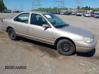 1999 Ford Contour z VIN 1FAFP653XXK134482, wystawiony jako IAAI lot #42224788 z przebiegiem 92 501 mil mil oraz . Historia ofert i sprzedaży dostępna na DreamBid. Obrazek 1.