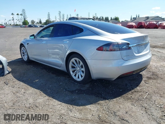 2016 Tesla Model S 90D with VIN 5YJSA1E22GF174637, listed as a IAAI auction lot 42234083 with 142,915 mi miles and . Bid and sale history available at DreamBid. Image 3.