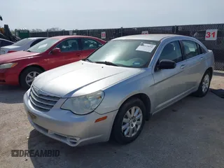 2010 Chrysler Sebring Touring with VIN 1C3CC4FB9AN115922, listed as a IAAI auction lot 42015051 with 152,305 mi miles and . Bid and sale history available at DreamBid. Image 2.