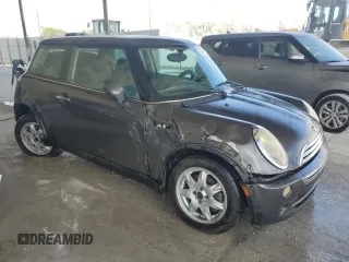 2006 MINI Hardtop with VIN WMWRC33526TK15620, listed as a Copart auction lot 54130715 with 116,981 mi miles and Salvage title. Bid and sale history available at DreamBid. Image 4.