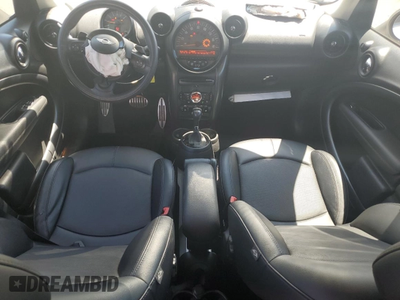 2016 MINI Countryman S with VIN WMWZC5C51GWU00690, listed as a Copart auction lot 55077095 with 104,176 mi miles and Salvage title. Bid and sale history available at DreamBid. Image 8.