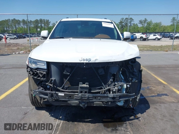 2015 Jeep Grand Cherokee Summit with VIN 1C4RJFJG1FC797711, listed as a IAAI auction lot 42026431 with 101,075 mi miles and . Bid and sale history available at DreamBid. Image 13.