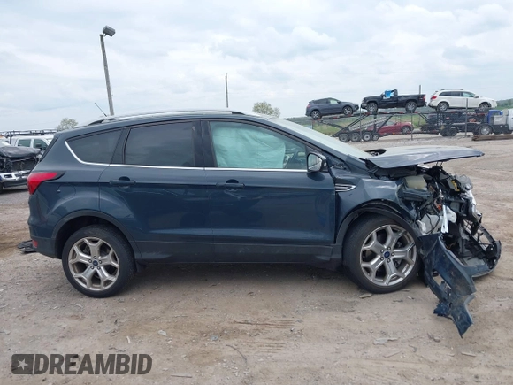 2019 Ford Escape Titanium with VIN 1FMCU9J95KUC19062, listed as a IAAI auction lot 42112188 with 26,100 mi miles. Bid and sale history available at carsss.com. Image 12.