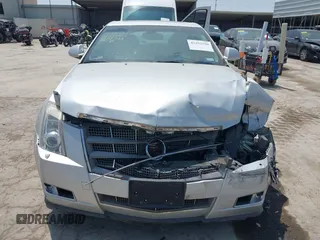 2009 Cadillac CTS RWD z VIN 1G6DV57V990149721, wystawiony jako IAAI lot #42293590 z przebiegiem 64 642 mil mil oraz . Historia ofert i sprzedaży dostępna na DreamBid. Obrazek 11.