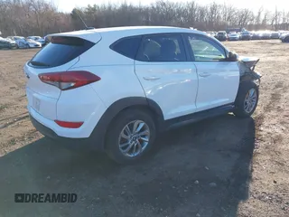 2017 Hyundai Tucson SE with VIN KM8J23A47HU291596, listed as a IAAI auction lot 41289118 with 55,876 mi miles and . Bid and sale history available at DreamBid. Image 4.