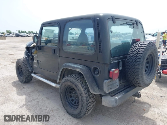 1999 Jeep Wrangler Sport z VIN 1J4FY19S0XP471848, wystawiony jako IAAI lot #42264563 z przebiegiem 280 121 mil mil oraz . Historia ofert i sprzedaży dostępna na DreamBid. Obrazek 3.
