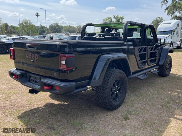 2020 Jeep Gladiator Rubicon with VIN 1C6JJTBG3LL117899, listed as a Copart auction lot 54328235 with 52,674 mi miles and Non Repairable. Bid and sale history available at carsss.com. Image 4.