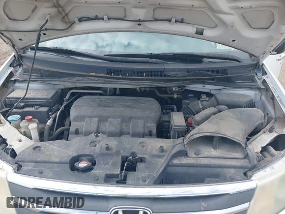 2012 Honda Odyssey EX-L with VIN 5FNRL5H63CB117341, listed as a IAAI auction lot 42197815 with 256,544 mi miles and . Bid and sale history available at DreamBid. Image 10.