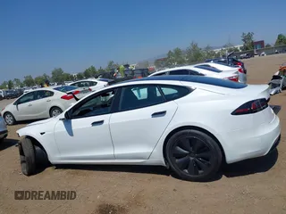 2023 Tesla Model S with VIN 5YJSA1E51PF499919, listed as a IAAI auction lot 42459166 with 6,612 mi miles and . Bid and sale history available at DreamBid. Image 15.