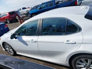 2020 Toyota Camry LE with VIN 4T1C11AKXLU986310, listed as a IAAI auction lot 40977100 with 108,208 mi miles and . Bid and sale history available at DreamBid. Image 14.