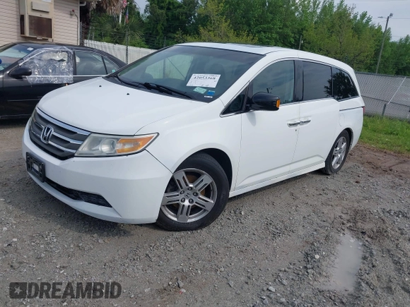 2011 Honda Odyssey Touring with VIN 5FNRL5H90BB066177, listed as a IAAI auction lot 42053368 with 239,205 mi miles and . Bid and sale history available at DreamBid. Image 17.