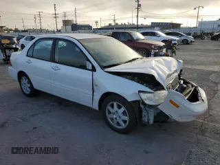 2002 Mitsubishi Lancer LS with VIN JA3AJ36E02U064779, listed as a Copart auction lot 86749184 with 127,343 mi miles and Salvage Title. Bid and sale history available at carsss.com. Image 4.