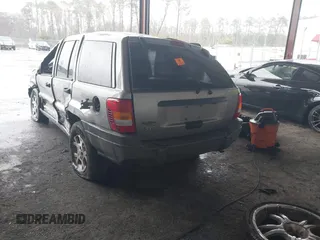 2001 Jeep Grand Cherokee Laredo with VIN 1J4GX48S51C708990, listed as a IAAI auction lot 41656323 with 198,124 mi miles and . Bid and sale history available at DreamBid. Image 3.