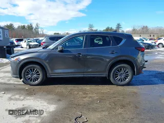2017 Mazda CX-5 Touring with VIN JM3KFBCL3H0214881, listed as a IAAI auction lot 41694560 with 64,609 mi miles. Bid and sale history available at carsss.com. Image 14.