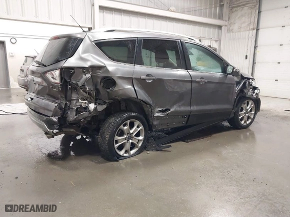 2014 Ford Escape Titanium with VIN 1FMCU9JX0EUB34228, listed as a IAAI auction lot 41713706 with 95,677 mi miles. Bid and sale history available at carsss.com. Image 4.