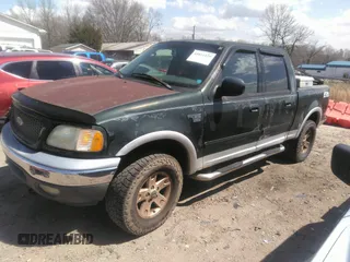 2002 Ford F-150 XLT with VIN 1FTRW08L12KC44008, listed as a IAAI auction lot 41811120 with 306,235 mi miles. Bid and sale history available at carsss.com. Image 2.