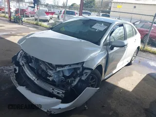 2021 Toyota Corolla Hybrid LE with VIN JTDEAMDE7MJ012694, listed as a IAAI auction lot 41794233 with 103,363 mi miles. Bid and sale history available at carsss.com. Image 2.