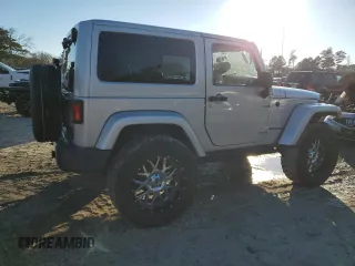 2011 Jeep Wrangler Sahara with VIN 1J4GA5D14BL628876, listed as a Copart auction lot 87317374 with 84,179 mi miles and Salvage Title. Bid and sale history available at DreamBid. Image 3.