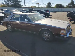 1984 Cadillac Seville z VIN 1G6AS6984EE826325, wystawiony jako Copart lot #77209864 z przebiegiem 26 366 mil mil oraz Tytuł czysty. Historia ofert i sprzedaży dostępna na DreamBid. Obrazek 4.
