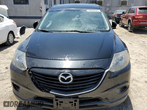 2015 Mazda CX-9 Sport z VIN JM3TB2BAXF0447315, wystawiony jako Copart lot #60842505 z przebiegiem 122 281 mil mil oraz Szkoda całkowita • Salvage title. Historia ofert i sprzedaży dostępna na DreamBid. Obrazek 5.