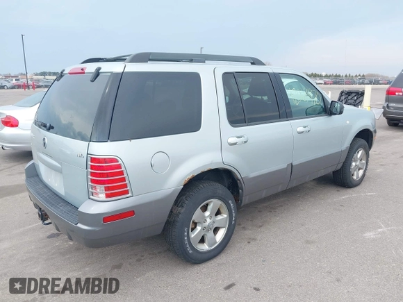 2005 Mercury Mountaineer Convenience z VIN 4M2ZU86K65UJ10015, wystawiony jako IAAI lot #42063970 z przebiegiem 153 542 mil mil oraz . Historia ofert i sprzedaży dostępna na DreamBid. Obrazek 4.
