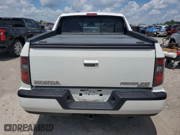 2012 Honda Ridgeline RTL with VIN 5FPYK1F56CB002709, listed as a Copart auction lot 62642495 with 116,416 mi miles and Salvage title. Bid and sale history available at DreamBid. Image 6.