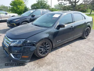 2012 Ford Fusion Hybrid z VIN 3FADP0L32CR364546, wystawiony jako IAAI lot #42418735 z przebiegiem 148 242 mil mil oraz . Historia ofert i sprzedaży dostępna na DreamBid. Obrazek 2.