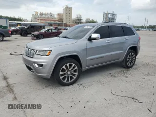 2017 Jeep Grand Cherokee Overland with VIN 1C4RJECG1HC813996, listed as a Copart auction lot 59591375 with 122,899 mi miles and Salvage title. Bid and sale history available at DreamBid. Image 1.