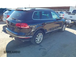 2016 Volkswagen Touareg Sport with VIN WVGEF9BP4GD012265, listed as a IAAI auction lot 41208383 with 69,205 mi miles and . Bid and sale history available at DreamBid. Image 4.
