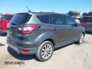 2018 Ford Escape Titanium with VIN 1FMCU0J99JUB09562, listed as a IAAI auction lot 41547659 with 63,700 mi miles and . Bid and sale history available at DreamBid. Image 4.