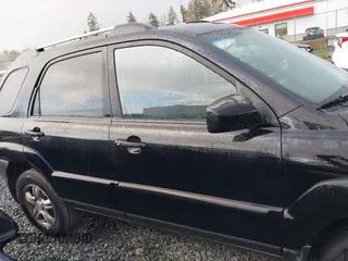 2005 Kia Sportage LX with VIN KNDJF723557054234, listed as a IAAI auction lot 40652851 with 220,215 mi miles and . Bid and sale history available at carsss.com. Image 13.