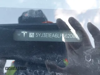 2020 Tesla Model 3 Standard Range Plus z VIN 5YJ3E1EA6LF662080, wystawiony jako IAAI lot #41410445 z przebiegiem Nie podano mil oraz . Historia ofert i sprzedaży dostępna na DreamBid. Obrazek 9.
