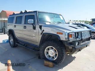 2003 Hummer H2 z VIN 5GRGN23UX3H146579, wystawiony jako IAAI lot #42050498 z przebiegiem 184 526 mil mil oraz . Historia ofert i sprzedaży dostępna na DreamBid. Obrazek 1.