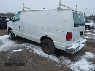 2011 Ford Econoline Cargo Commercial with VIN 1FTNE1EWXBDA35585, listed as a IAAI auction lot 41349320 with 122,311 mi miles and . Bid and sale history available at carsss.com. Image 3.
