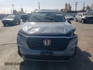 2023 Honda Pilot Touring with VIN 5FNYG2H7XPB011420, listed as a Copart auction lot 69799314 with 9,601 mi miles and Salvage Title. Bid and sale history available at carsss.com. Image 5.