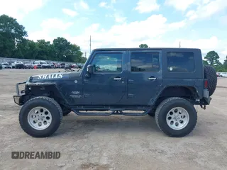 2008 Jeep Wrangler Unlimited Sahara with VIN 1J4GA591X8L520621, listed as a IAAI auction lot 42525613 with 184,239 mi miles and . Bid and sale history available at DreamBid. Image 14.