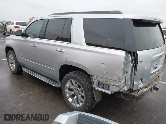2015 GMC Yukon SLT with VIN 1GKS2BKCXFR131919, listed as a IAAI auction lot 41664827 with 149,398 mi miles. Bid and sale history available at carsss.com. Image 3.