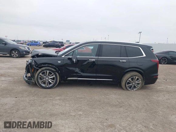 2023 Cadillac XT6 FWD Premium Luxury with VIN 1GYKPCRS8PZ231089, listed as a IAAI auction lot 41500954 with 36,455 mi miles and . Bid and sale history available at DreamBid. Image 14.