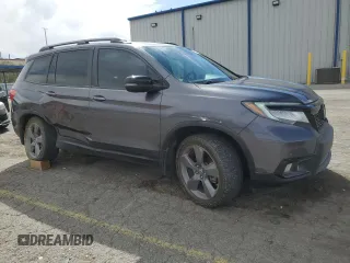 2020 Honda Passport Touring z VIN 5FNYF8H9XLB007336, wystawiony jako Copart lot #51012975 z przebiegiem 74 620 mil mil oraz Szkoda całkowita • Salvage title. Historia ofert i sprzedaży dostępna na DreamBid. Obrazek 4.