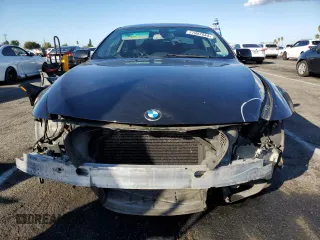 2008 BMW 6 Series 650i with VIN WBAEA53508CV90599, listed as a Copart auction lot 77907544 with 0 mi miles and Salvage Title. Bid and sale history available at carsss.com. Image 5.