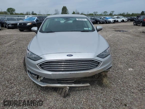 2018 Ford Fusion SE z VIN 3FA6P0H74JR112086, wystawiony jako Copart lot #56630275 z przebiegiem 123 300 mil mil oraz Szkoda całkowita • Salvage title. Historia ofert i sprzedaży dostępna na DreamBid. Obrazek 5.