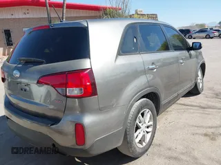 2014 Kia Sorento LX with VIN 5XYKT3A6XEG480411, listed as a IAAI auction lot 42008356 with 137,435 mi miles and . Bid and sale history available at DreamBid. Image 4.