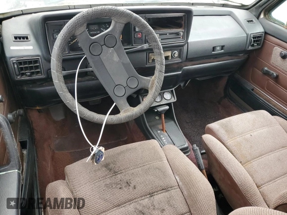 1984 Volkswagen Rabbit z VIN WVWCA0152EK015292, wystawiony jako Copart lot #55503315 z przebiegiem 216 970 mil mil oraz Tytuł czysty. Historia ofert i sprzedaży dostępna na DreamBid. Obrazek 8.