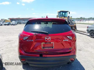 2016 Mazda CX-5 Touring with VIN JM3KE2CY6G0830409, listed as a IAAI auction lot 42049299 with 39,317 mi miles. Bid and sale history available at carsss.com. Image 16.