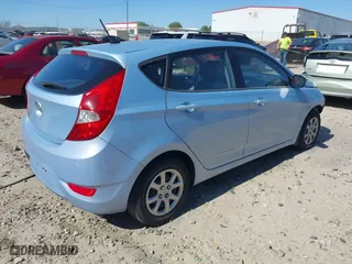 2014 Hyundai Accent GS with VIN KMHCT5AE1EU187112, listed as a IAAI auction lot 41894869 with 100,640 mi miles. Bid and sale history available at carsss.com. Image 4.