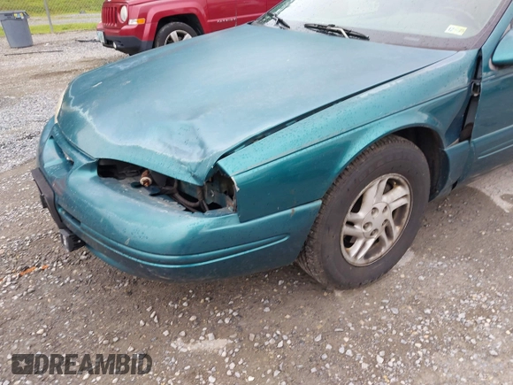1996 Ford Thunderbird LX z VIN 1FALP62W9TH118637, wystawiony jako IAAI lot #42311641 z przebiegiem 96 361 mil mil oraz . Historia ofert i sprzedaży dostępna na DreamBid. Obrazek 6.