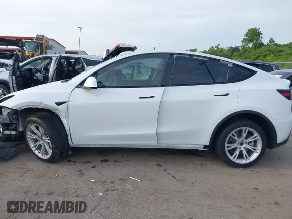 2023 Tesla Model Y Long Range with VIN 7SAYGDEE4PF770307, listed as a IAAI auction lot 42141175 with 34,901 mi miles and . Bid and sale history available at carsss.com. Image 15.